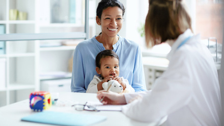 smiling-young-mother-sitting-together-smaller.jpg