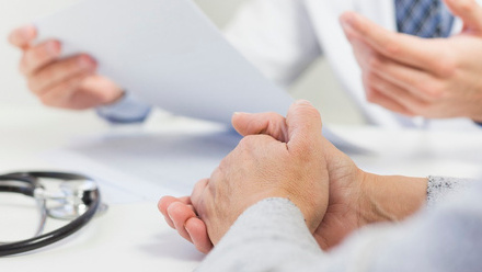 close-up-doctor-his-office-discussing-medical-report-with-patient.jpg
